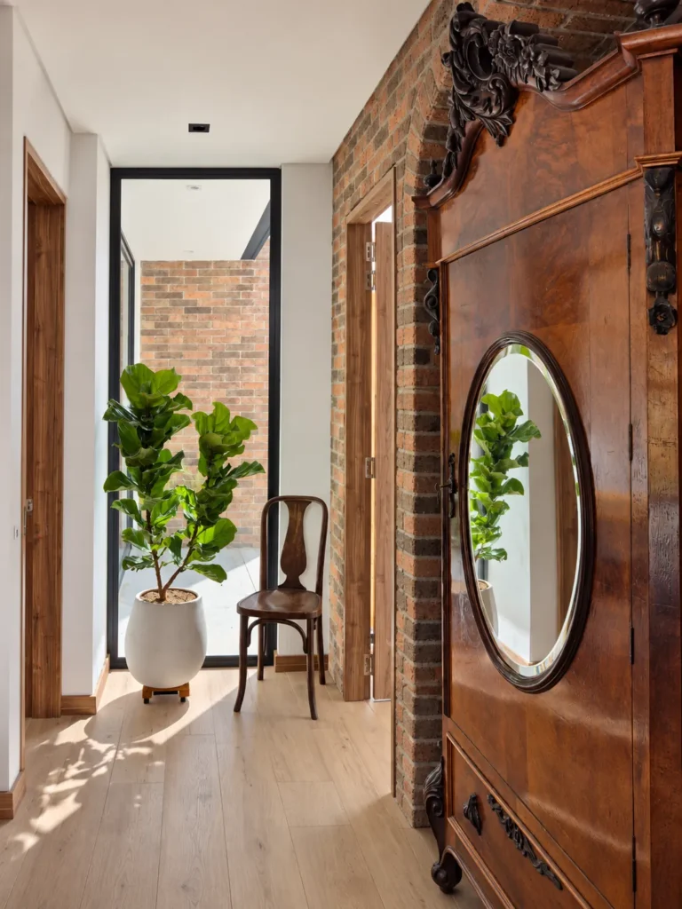 Casa Botero – hall with antique wooden door and oval window
