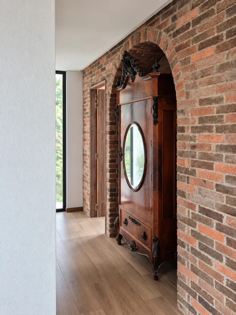 Casa Botero – antique door beneath a brick arch