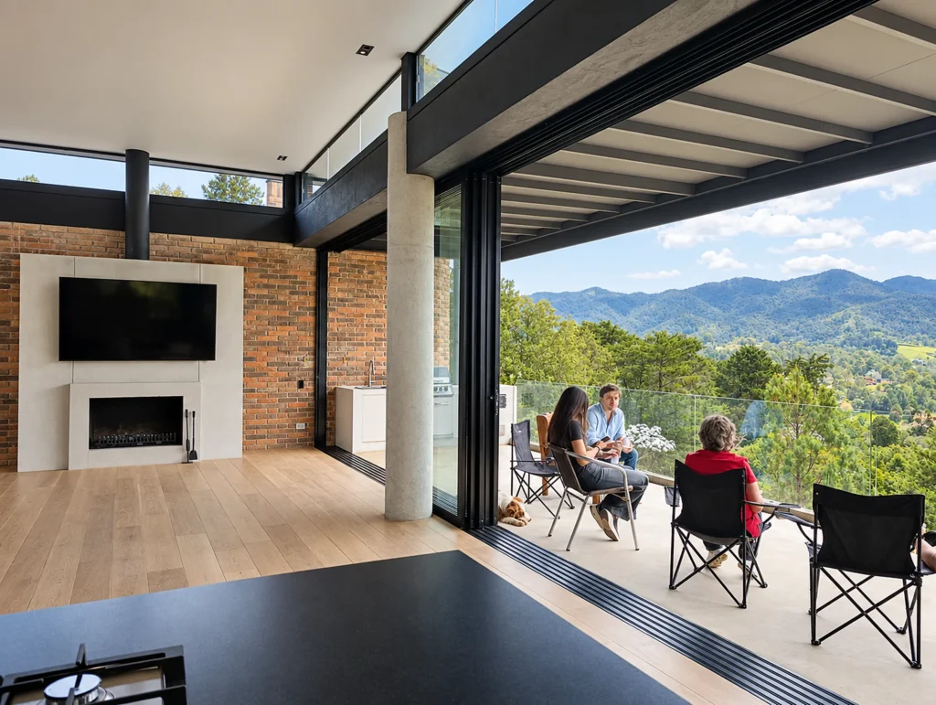 Casa Botero – living room with fireplace opening onto the terrace