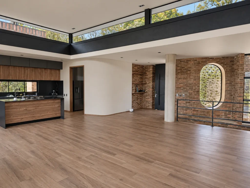 Casa Botero – open social area with kitchen and round window