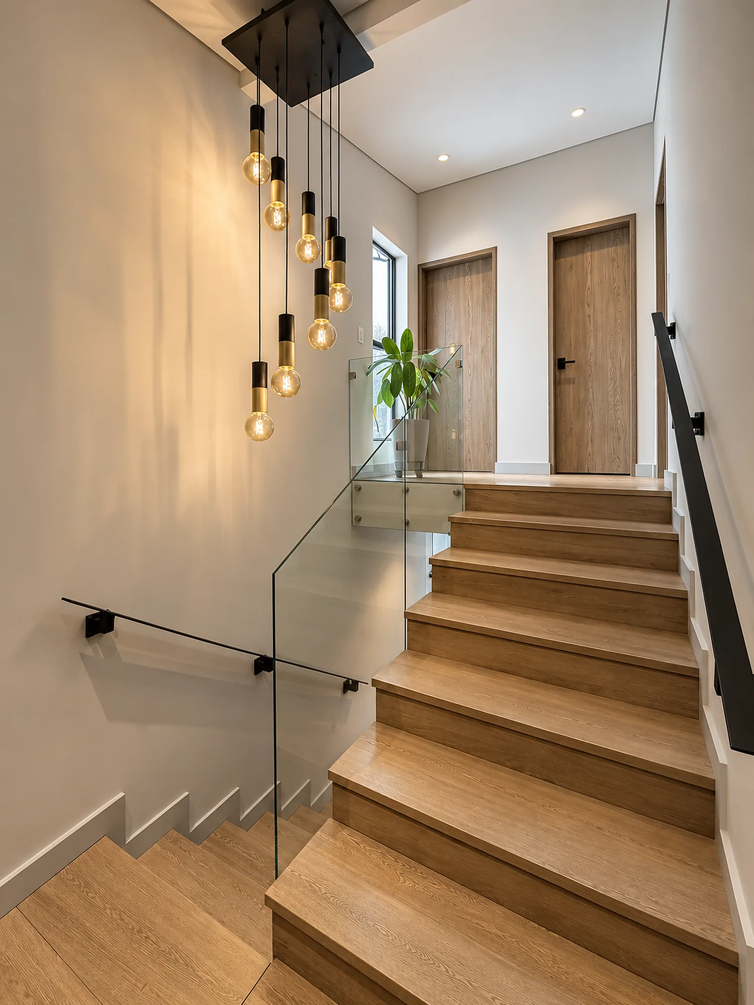 Casa Gascuña S&A – Wood staircase with glass railing