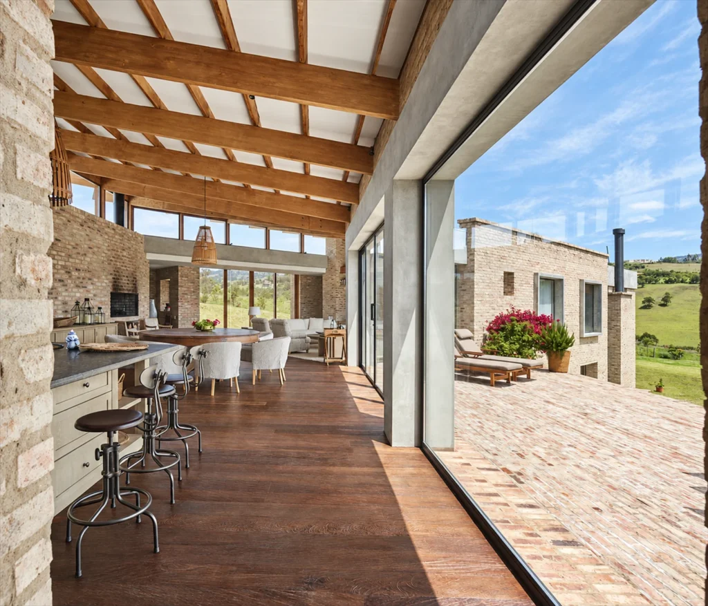Casa Subachoque – corridor with timber roof and open kitchen