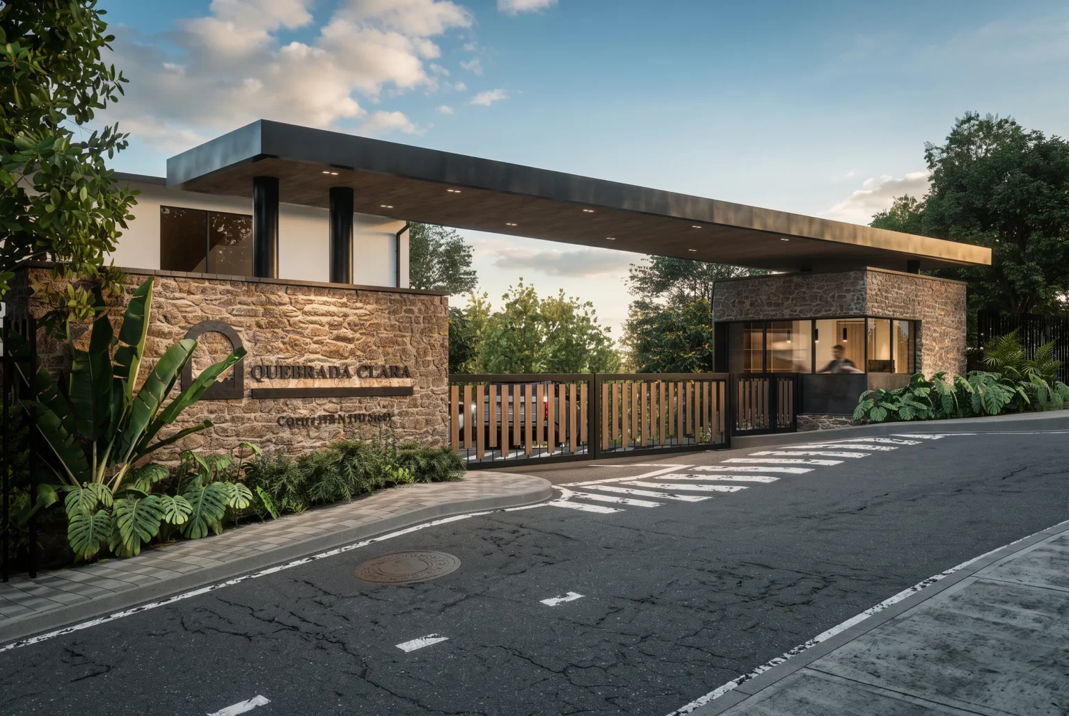 Quebrada Clara Gatehouse – entrance with cantilevered roof and stone wall at sunset, Envigado