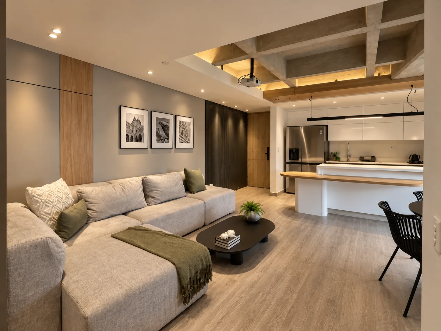 Rosset Apartment – living room with L-shaped sofa and kitchen beyond